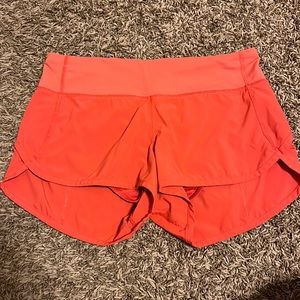 lululemon orange speed ups - size 4 and 2.5 inch - low rise